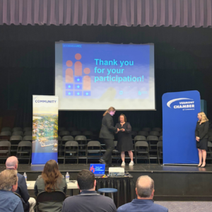 A state finalist walks the stage at the 2026 National Civics Bee Vermont State Finals