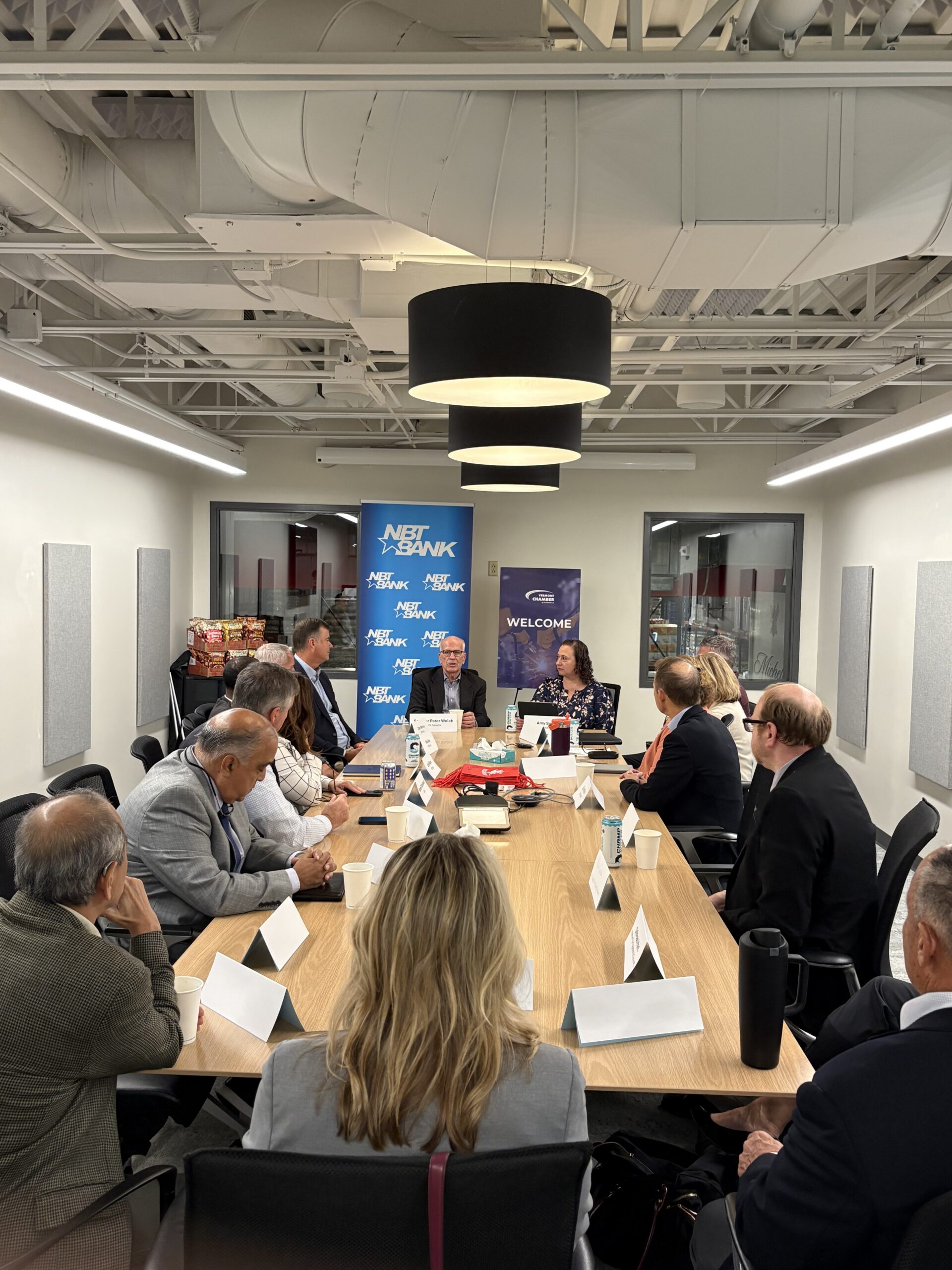 Attendees seated around a table during the Vermont Chamber's Wellspring Forum.