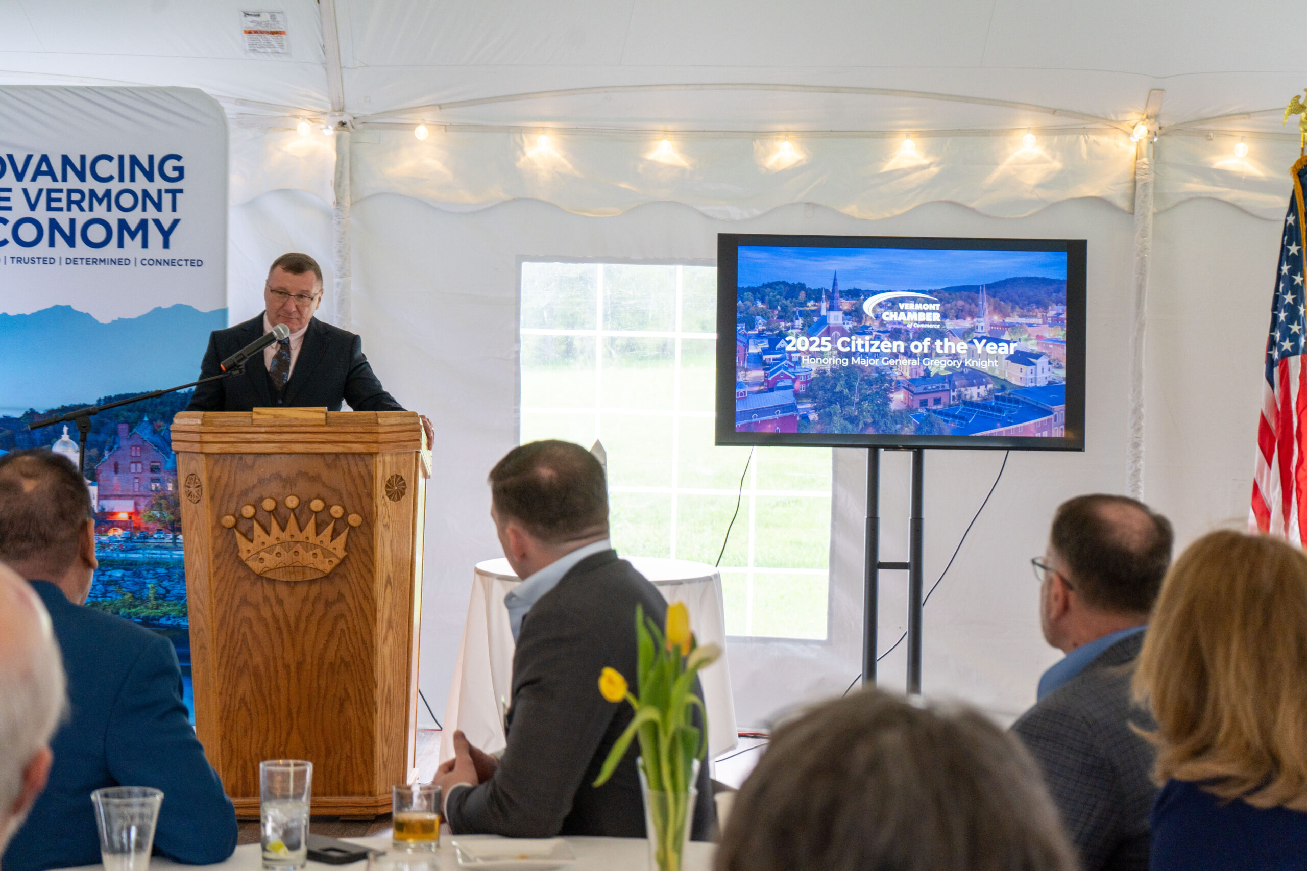 MG Knight standing at a podium speaking to a crowd