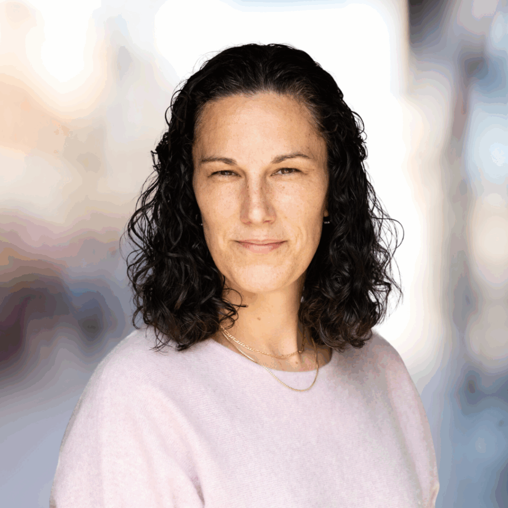 Mari McClure headshot on blurred background