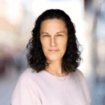 Mari McClure headshot on blurred background