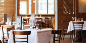A brightly lit and inviting restaurant ready to open.