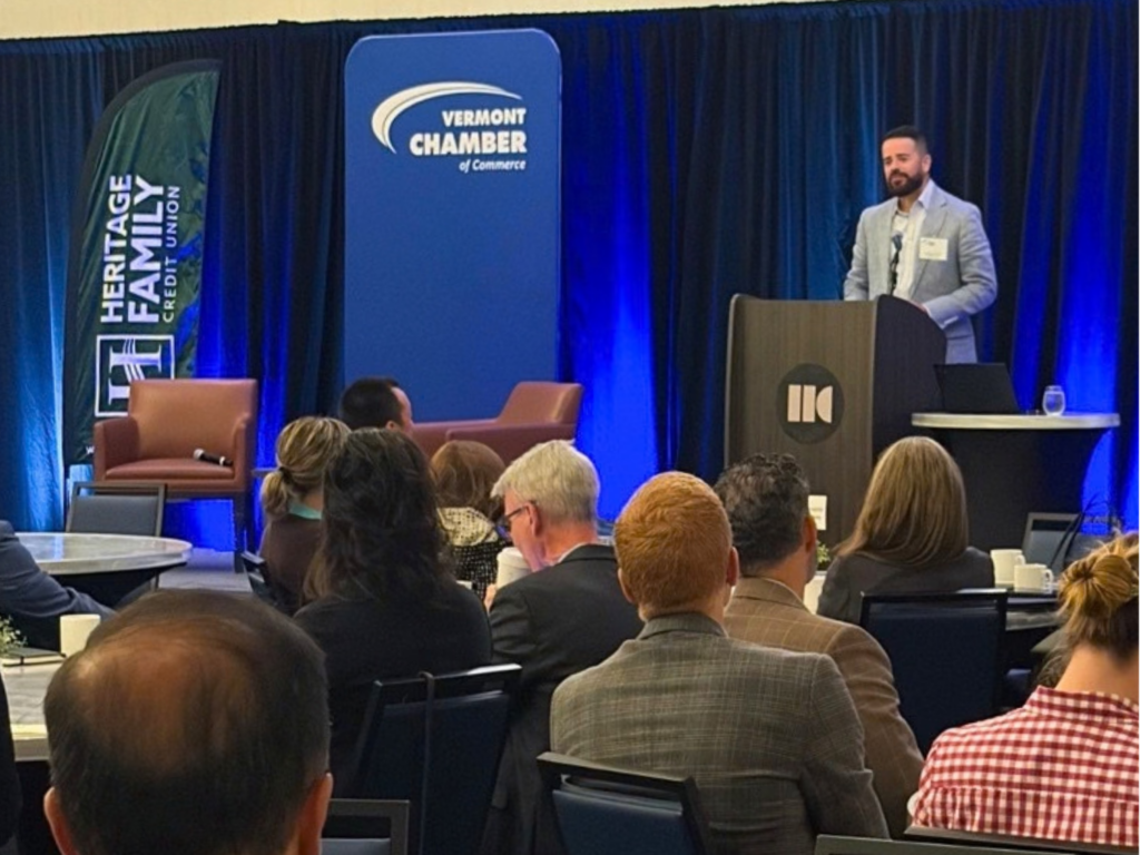 Chris Gomez of the presenting sponsor, Heritage Family Credit Union, speaks during the 2026 Solutions Summit