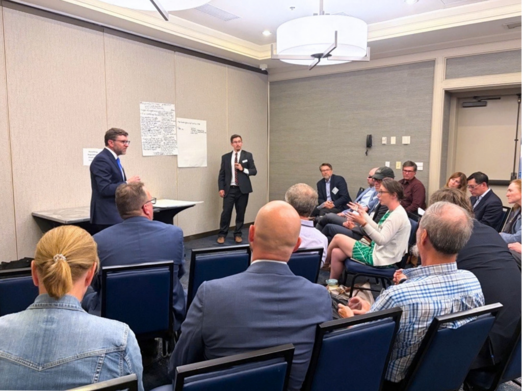 Neale Lunderville of VGS and the Vermont AI Economic Task Force facilitates a policy roundtable during the 2026 Solutions Summit