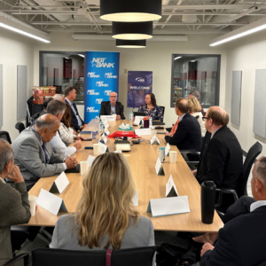 Attendees seated around a table during the Vermont Chamber's Wellspring Forum.